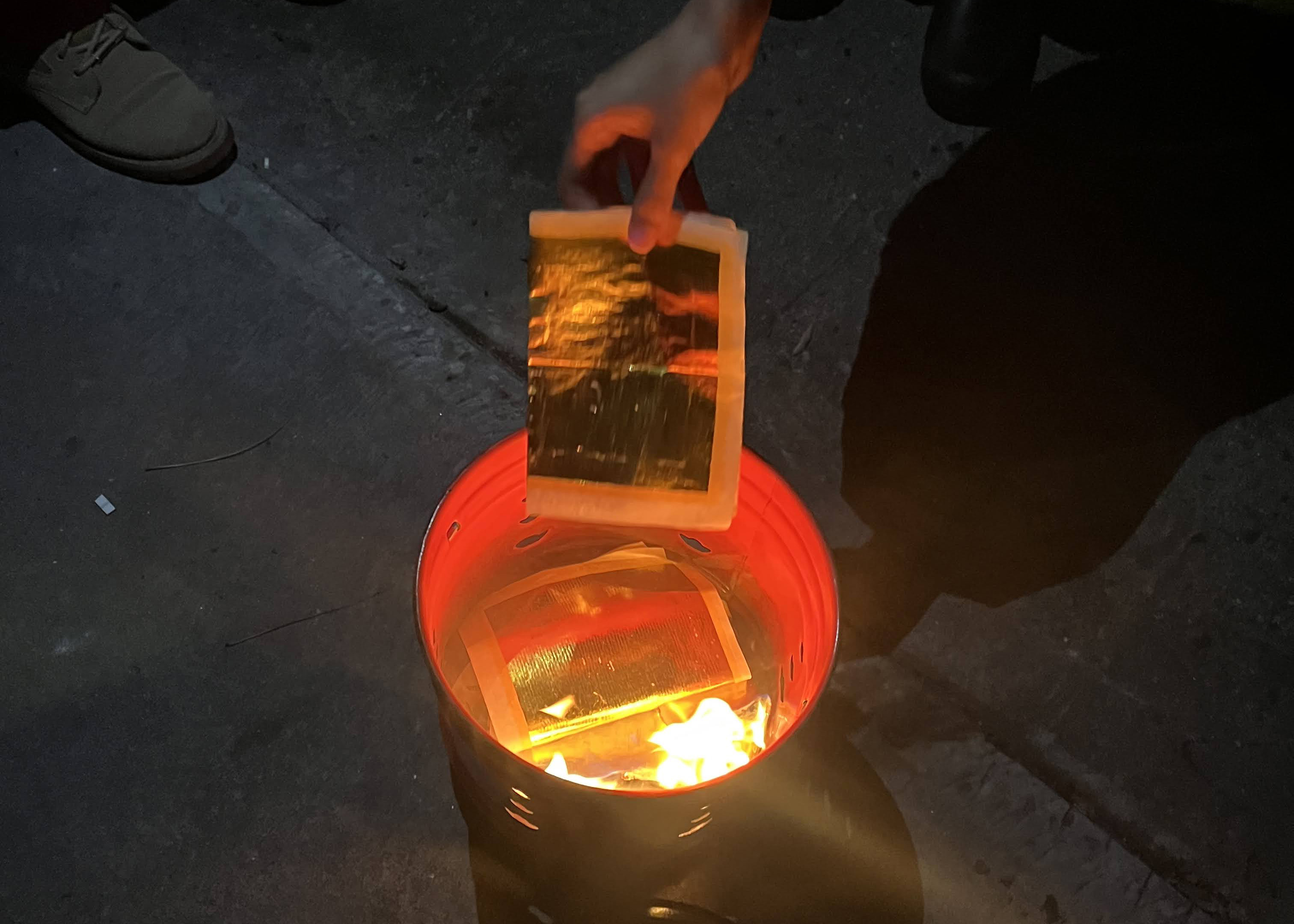 People sending-off their Jiama deities by burning it